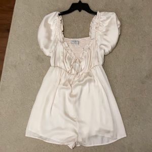 Cream romper size small never worn